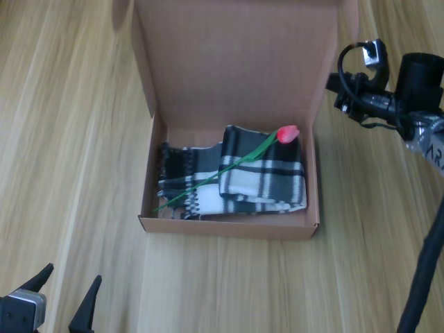 Box packing and closing, chronological frame 5 of 6 from Figure 11.